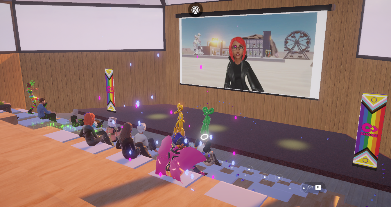 Everyone sitting in the metaverse campus watching the presenter.